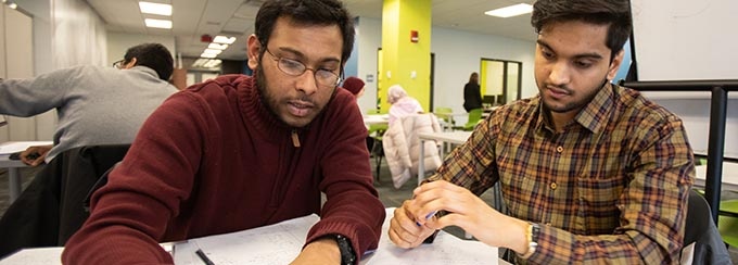 Two students working together.