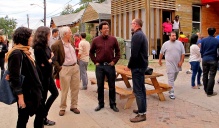 Residents, bcWORSKHOP staff, and guests—including Rick Lowe, founder of 1997 RBA Silver Medalist Project Row Houses—celebrate on Congo Street. (Courtesy Bruner Foundation). 