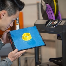 UB Engineering student working with 3D printing.