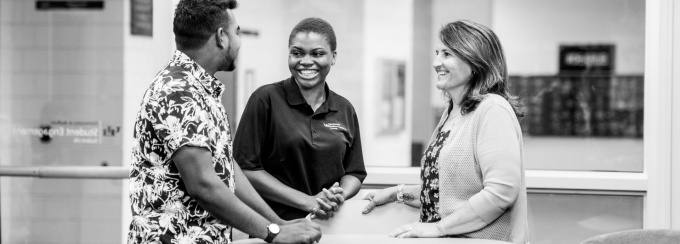 Students share stories with their supervisor about what they've learned in their work-study position in the Student Engagement office.