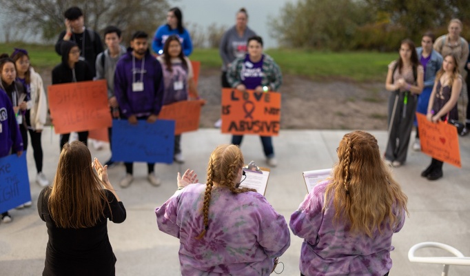 Students speaking against intimate partner violence by Baird Point at Take Back the Night in November 2023. 