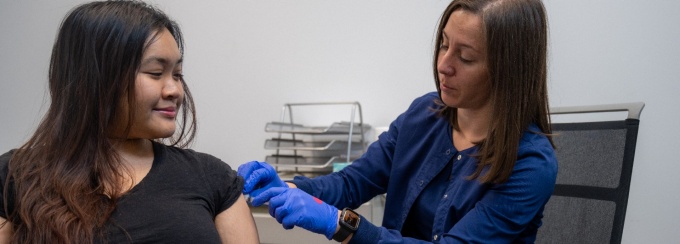 A nurse gives a flu shot to a student at the new Student Health Services facility.