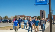 An admissions tour guide takes groups through an area of North Campus. 