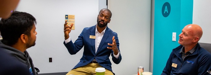 Fast 46 participants talking with current UB students.