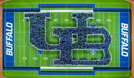 Aerial image of the annual human interlocking UB photo during opening weekend. 