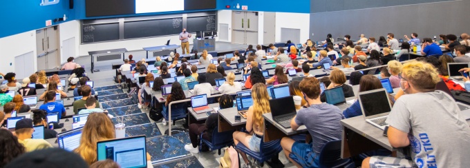 A large lecture hall of students. 