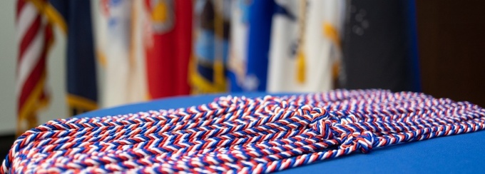 red, white and blue commencement cords at the Veterans ceremony.