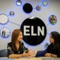 Two students meeting in front of ELNsign. 