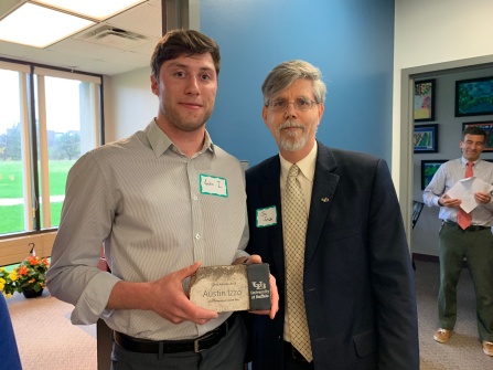 Austin Izzo accepts 2019 SLICE award.