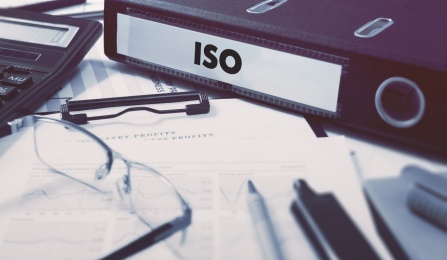 Binder with ISO typed on the spine.