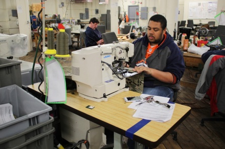 A worker at a sewing machine at The Resource Center.
