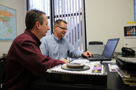 Flexovit USA executives looking at a computer.