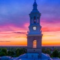 An sunset view of Hayes Hall clock tower on UB's South Campus. 