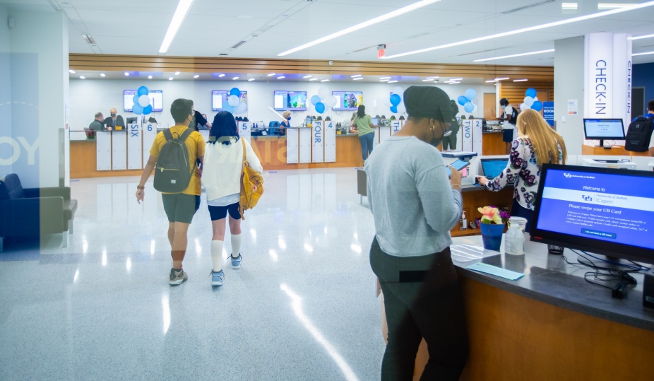 Wide photo of students utilizing the services in 1Capen. 