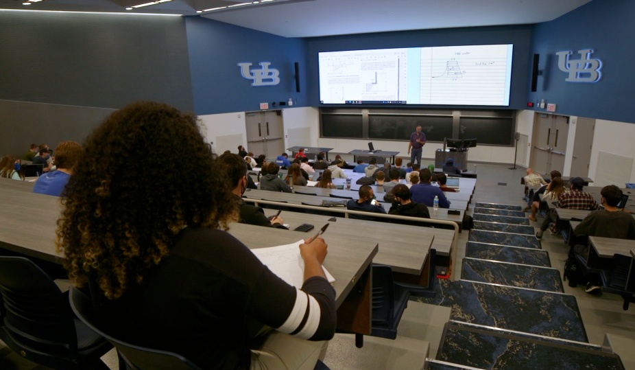 Students attending class in a lecture hall in the Natural Sciences Complex. 