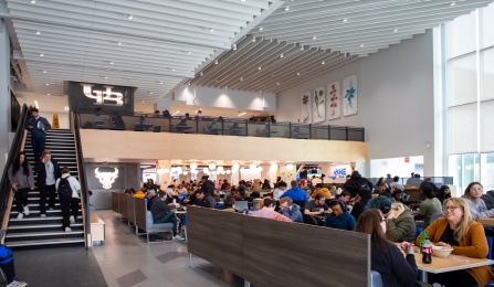 Wide shot of the interior of One World Café in Capen Hall. Image shows main level as well as loft area. 