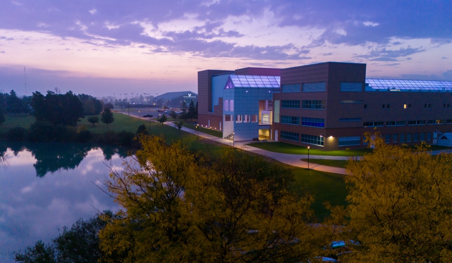 Aerial view of UB's Center for the Arts at sunrise with Murchie Family Fieldhouse in the background. 