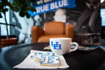 UB cut out cookie on coffee table next to UB mug.