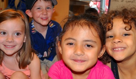 Photo - children looking at the camera.