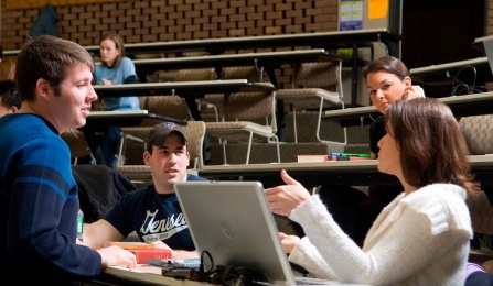 Students in discussion in a classroom.