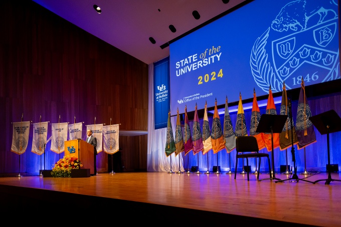 President Tripathi on stage delivering his State of the University address. 