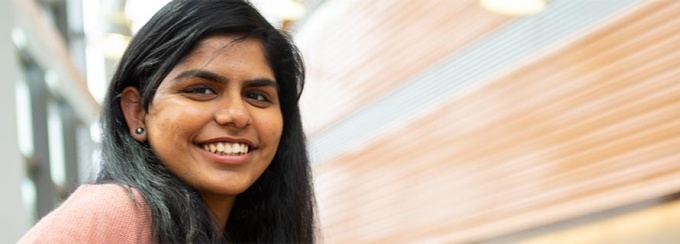 A student smiling at the camera.