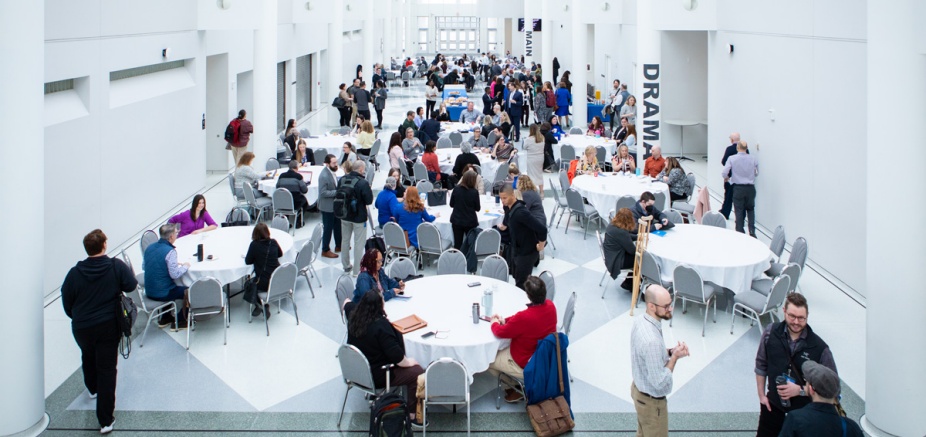 Communicators conference attendees congregating within the CFA atrium.