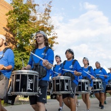 The UB Marching Band playing through campus. 