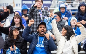 UB students cheering in the stands at a UB Football game. 