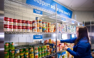 Zoom image: The Blue Table food pantry hosted an open house in January 2024 showcasing its newly renovated space, expanded operating hours and enhanced services inside the Student Union. The pantry was established in respond to a gubernatorial initiative, No Student Goes Hungry. Photographer: Meredith Forrest Kulwicki