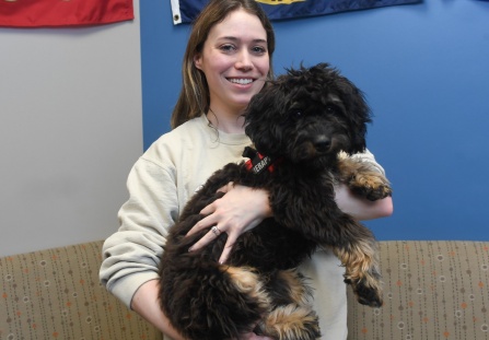 Kathleen Jackson holding Finn the dog. 