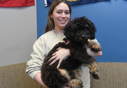 Kathleen Jackson holding Finn the dog.