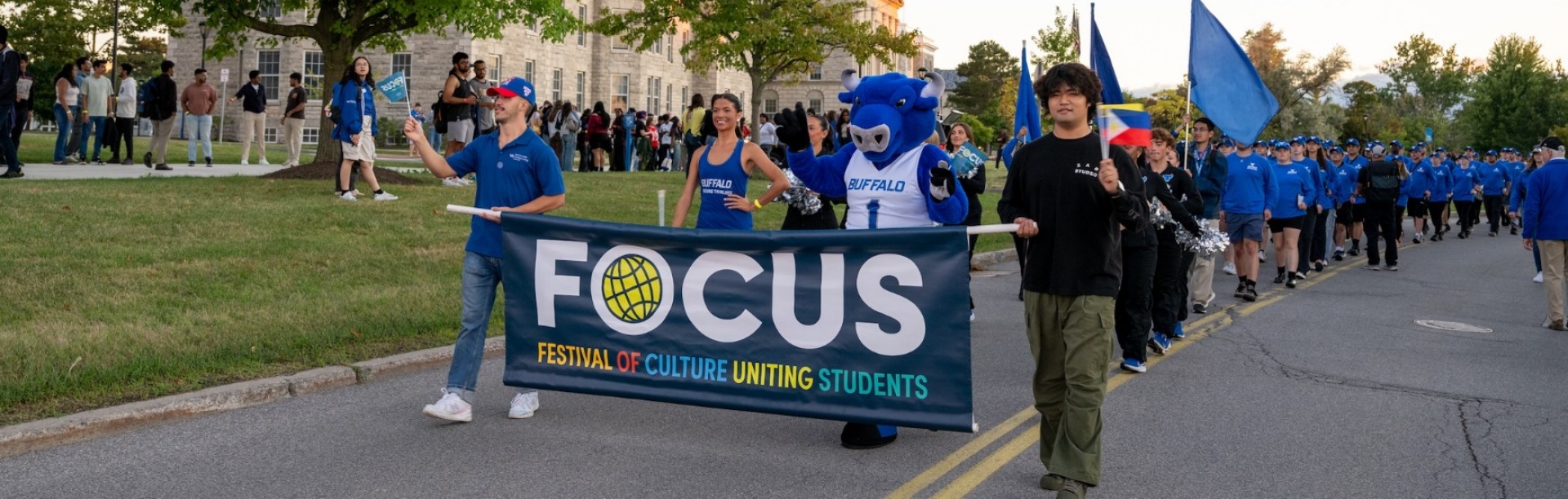 Students walking in the FOCUS parade on South Campus.